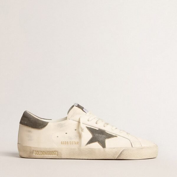White leather upper Perforated star Blue suede heel tab White laces Black Golden Goose wording Red stripe on the sole Ice-gray suede tongue Vintage finish Upper: 100% cow leather Lining: 53% cotton, 23% polyurethane, 9% viscose, 6% polyester Sole: 100% rubber Handmade Made in Italy
