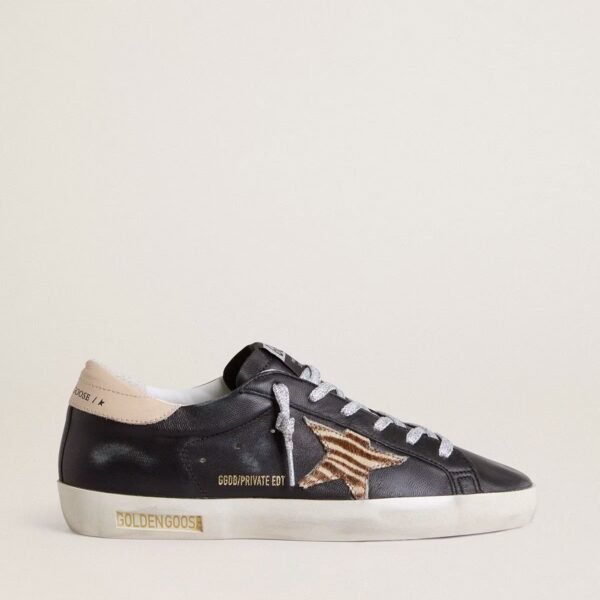 Golden Goose Super-Star in black nappa leather with zebra-print pony skin star and beige leather heel tab
